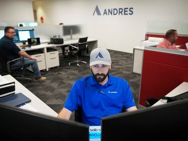 Tynan Day works at his desk at Andres Construction on Aug. 10 in Dallas.