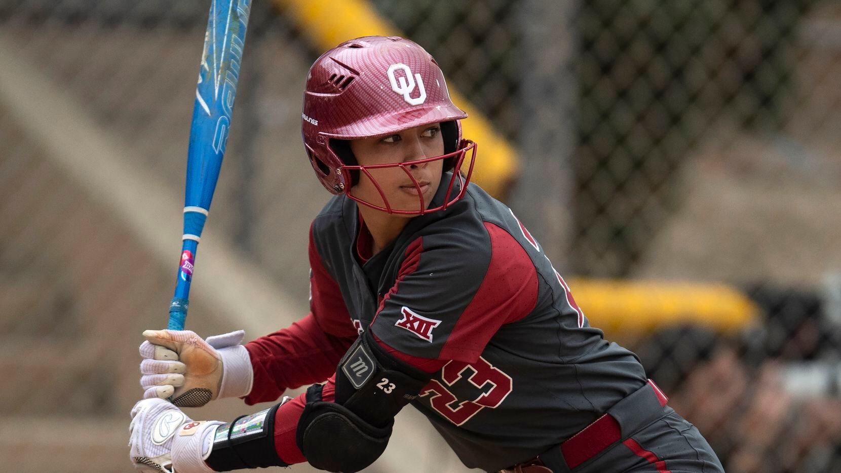 FILE - Oklahoma's Tiare Jennings (23) bats during an NCAA college softball game against...
