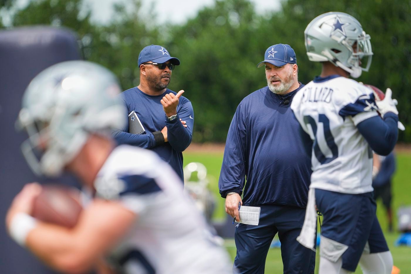 Dallas Cowboys head coach Mike McCarthy (right) and vice president of player personnel Will McClay watch their team run drills during a minicamp practice at The Star on Tuesday, June 8, 2021, in Frisco. (Smiley N. Pool/The Dallas Morning News)