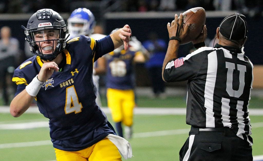 Highland Park quarterback Chandler Morris (4) flips the ball to the umpire after running for...
