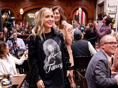 Influencer Carrie Jernigan wore a red-fringed cowboy boots and a Fancy t-shirt to country...