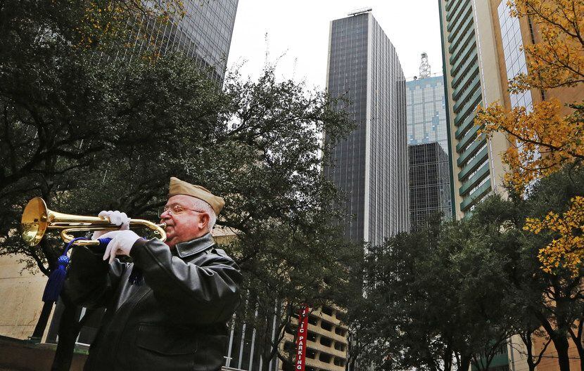 Bugler and Vietnam veteran Warren Hancock plays taps at the conclusion of a Pearl Harbor...