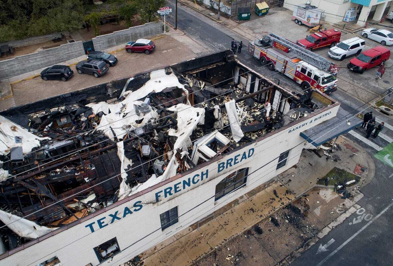 A look at Texas French Bread in Austin from above shows major damage to the roof after a...