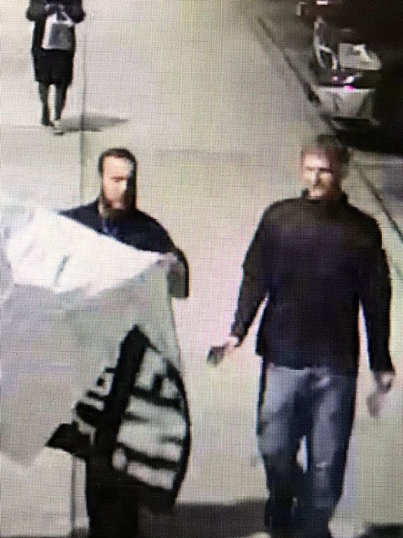 Two people from the group were seen carrying a banner at Park Cities Plaza after midnight Saturday.