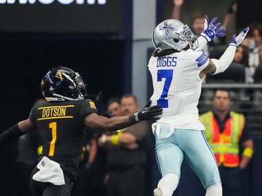 Dallas Cowboys cornerback Trevon Diggs (7) intercepts a pass intended for Washington...