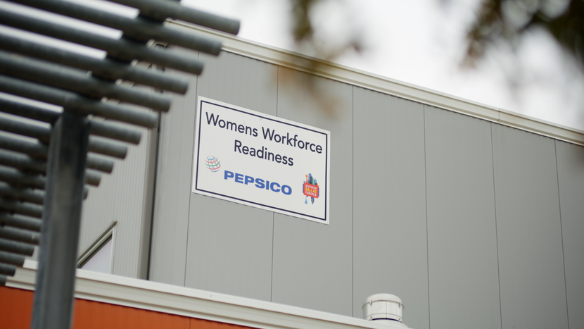 A photo of the Women's Workforce Readiness sign on its building.