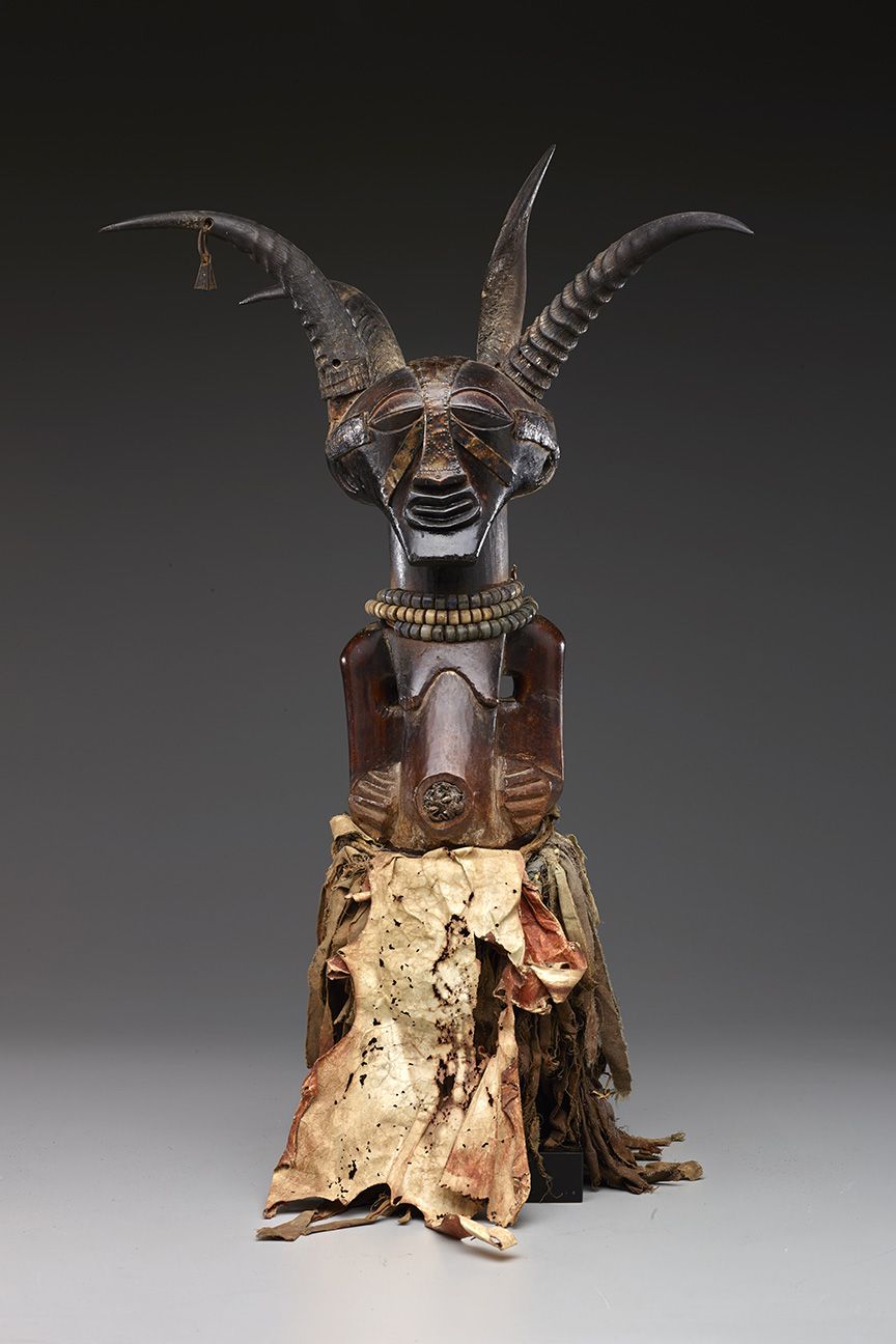 The exhibition features more than 200 works, including this four-horned power figure from...