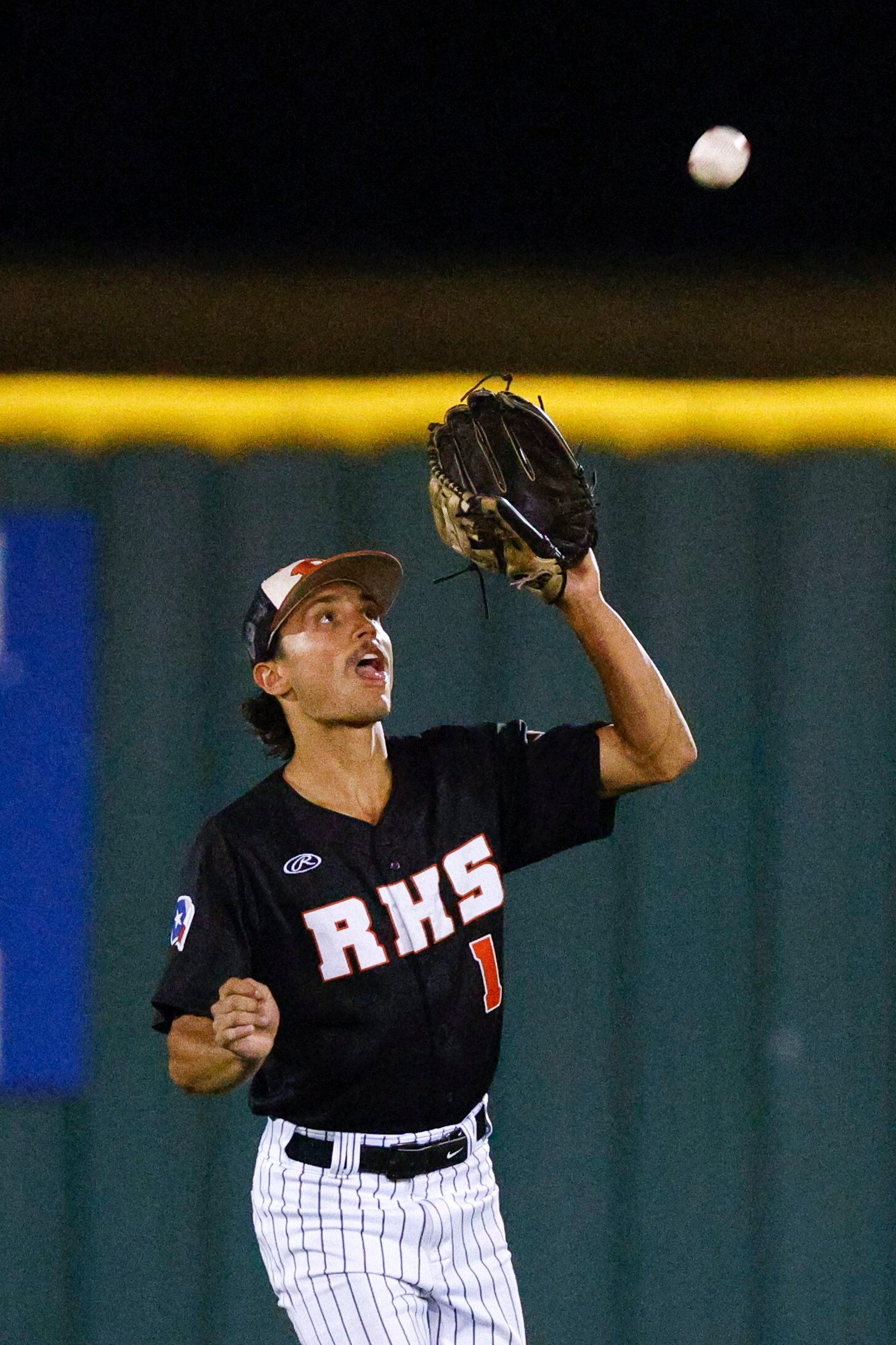 Rockwall centerfielder Andrew Tellia (1) catches a fly ball for an out during a Class 6A...