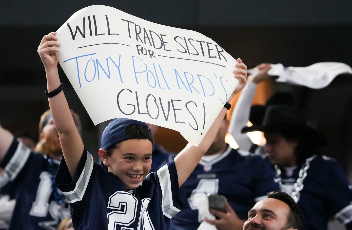 A Dallas Cowboys fan cheers for running back Tony Pollard during the first half of an NFL...