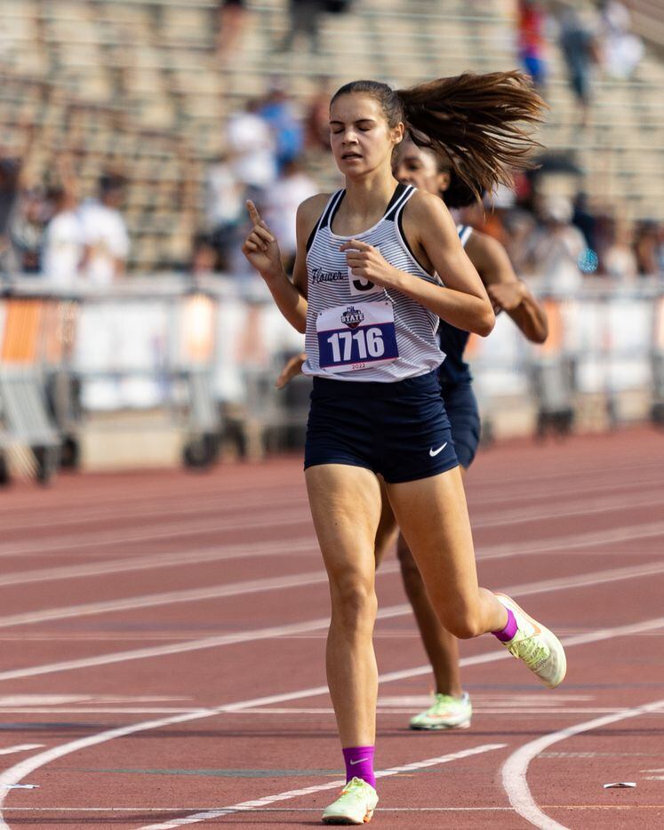 Samantha Humphries of Flower Mound raises up a single finger after finishing first in the...