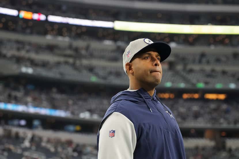 Dallas Cowboys defensive line coach Aden Durde watches the team warm up before an NFL...