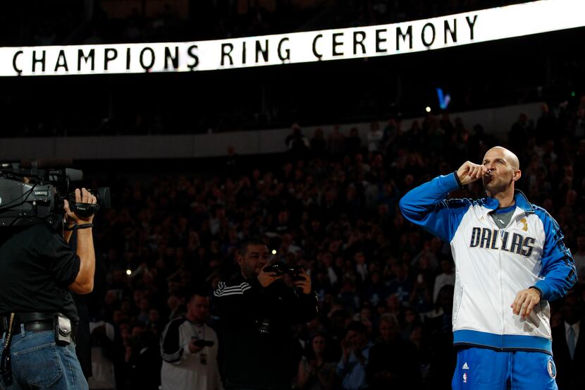 Dallas Mavericks point guard Jason Kidd (2) kisses his NBA championship ring during the ring...