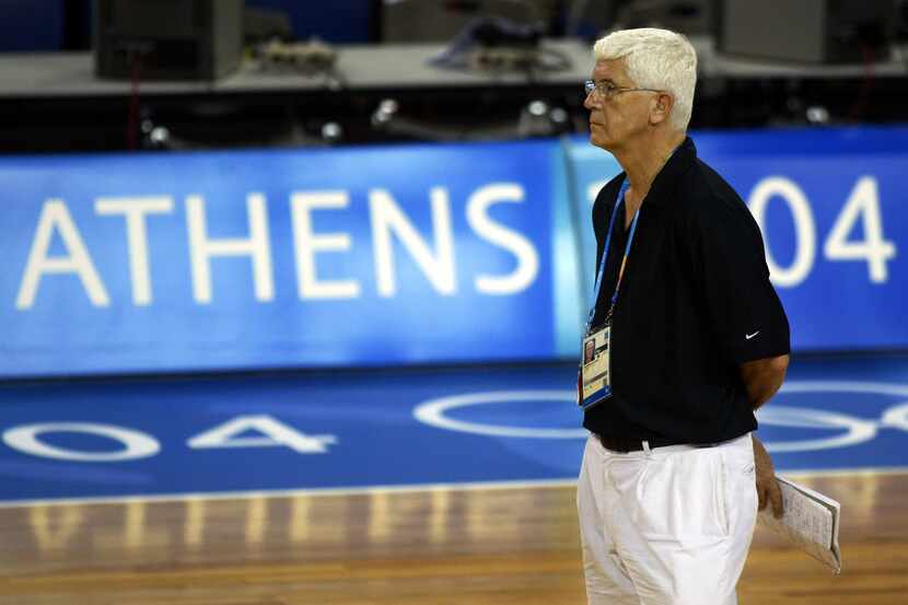 China team coach Del Harris, an assistant coach of the NBA Dallas Mavericks, watches his...