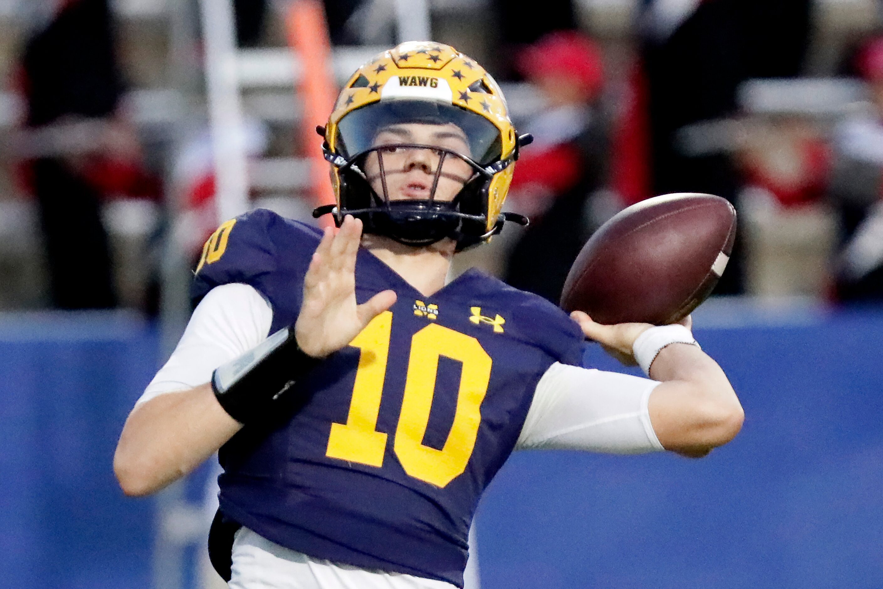 McKinney High School quarterback Jeremiah Daoud (10) throws a touchdown pass during the...