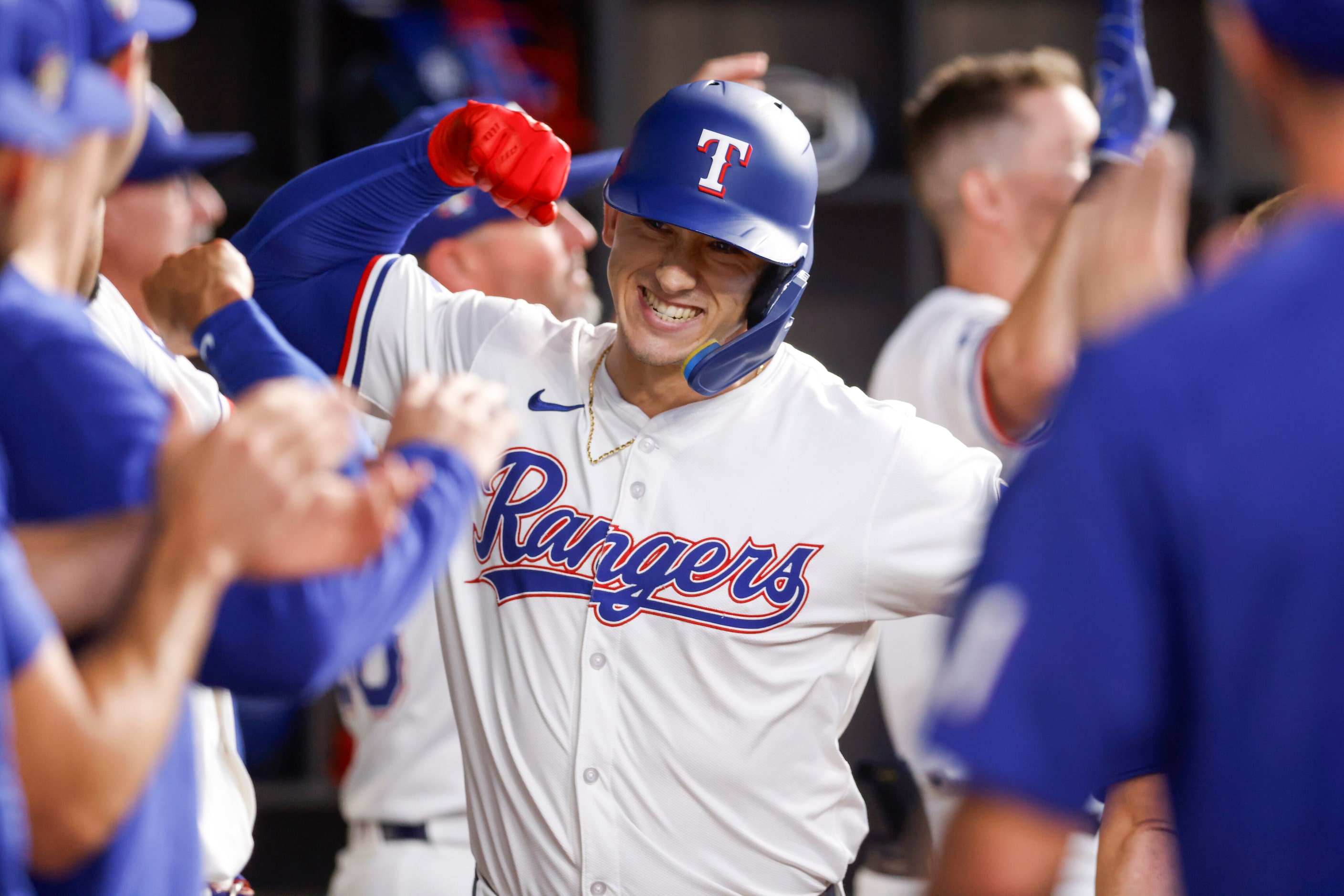 Texas Rangers left fielder Wyatt Langford (36) celebrates his first career grand slam with...