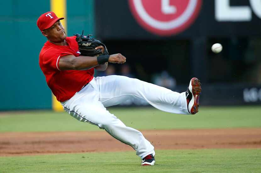 Texas Rangers third baseman Adrian Beltre (29) throws the ball to first during the first...