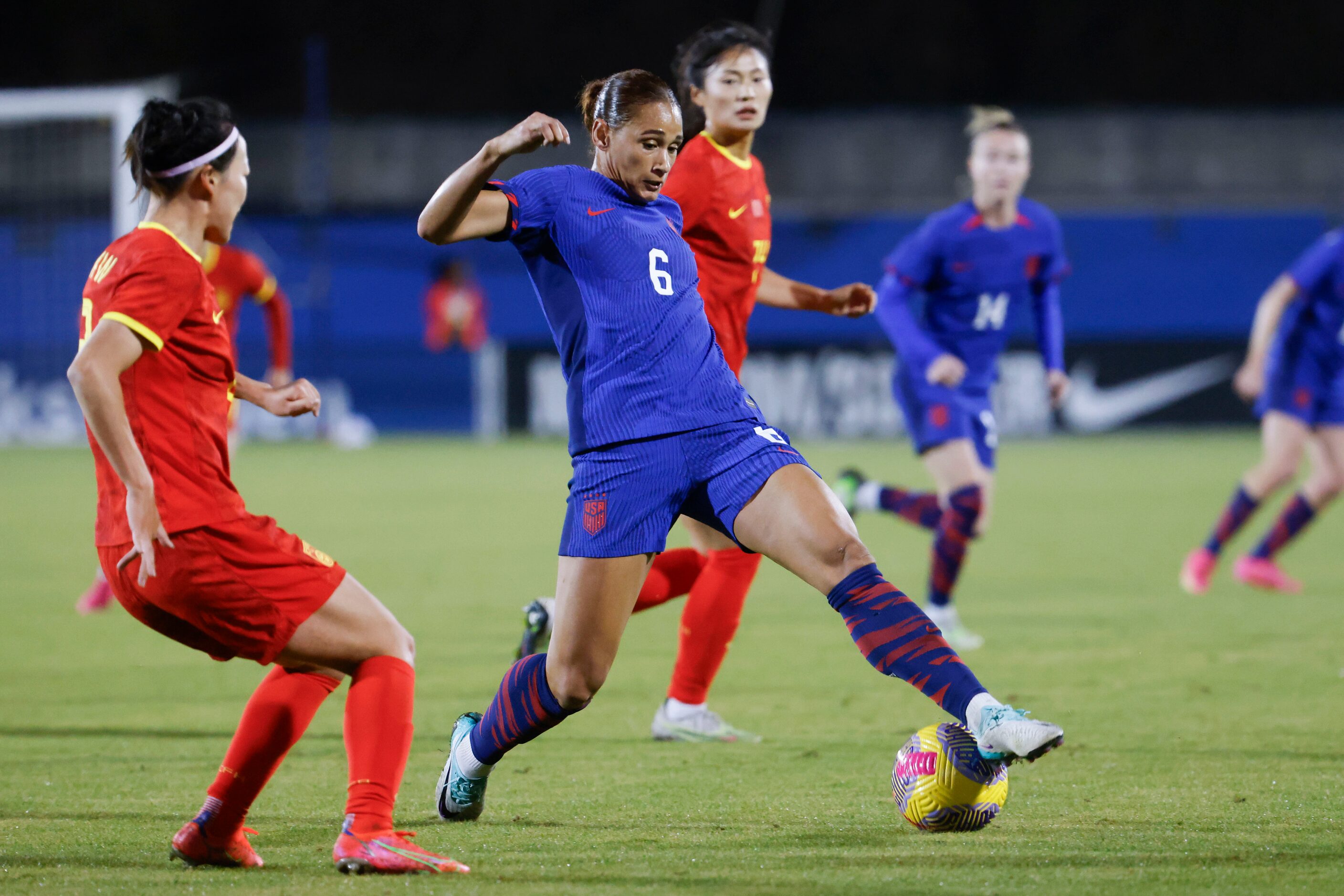 United States’ Lynn Williams (6) blocks a pass from  goes past China’s Li Mengwen (left)...