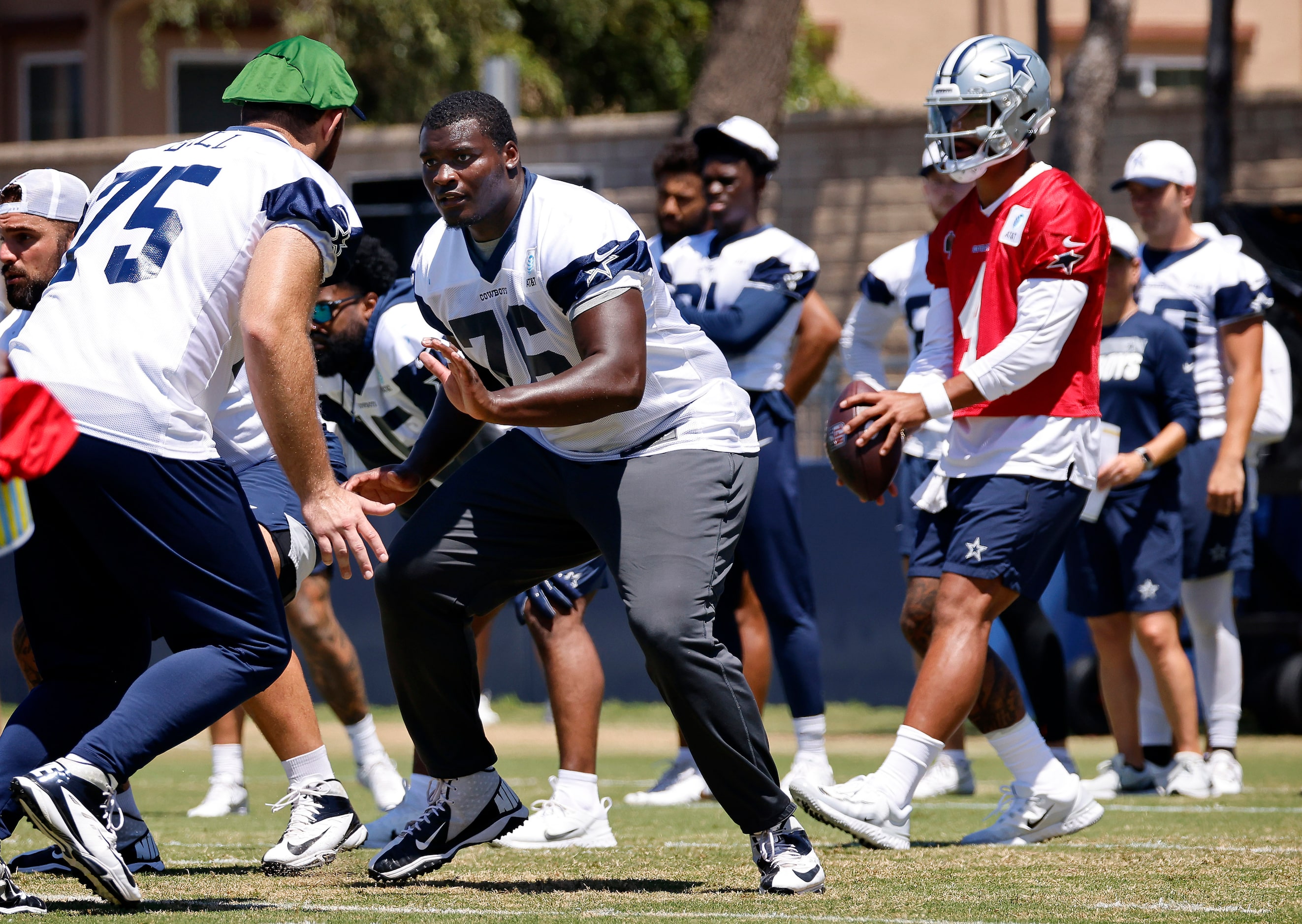 Dallas Cowboys offensive tackles Asim Richards (76) and Josh Ball (75) block one another...