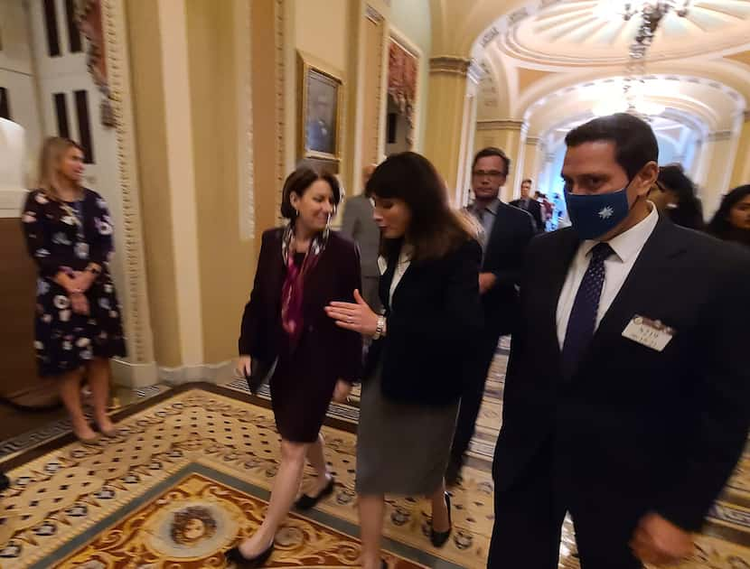 Sen. Amy Klobuchar, D-Minn. with state Rep. Gina Hinojosa, D-Austin, and state Rep. Trey...