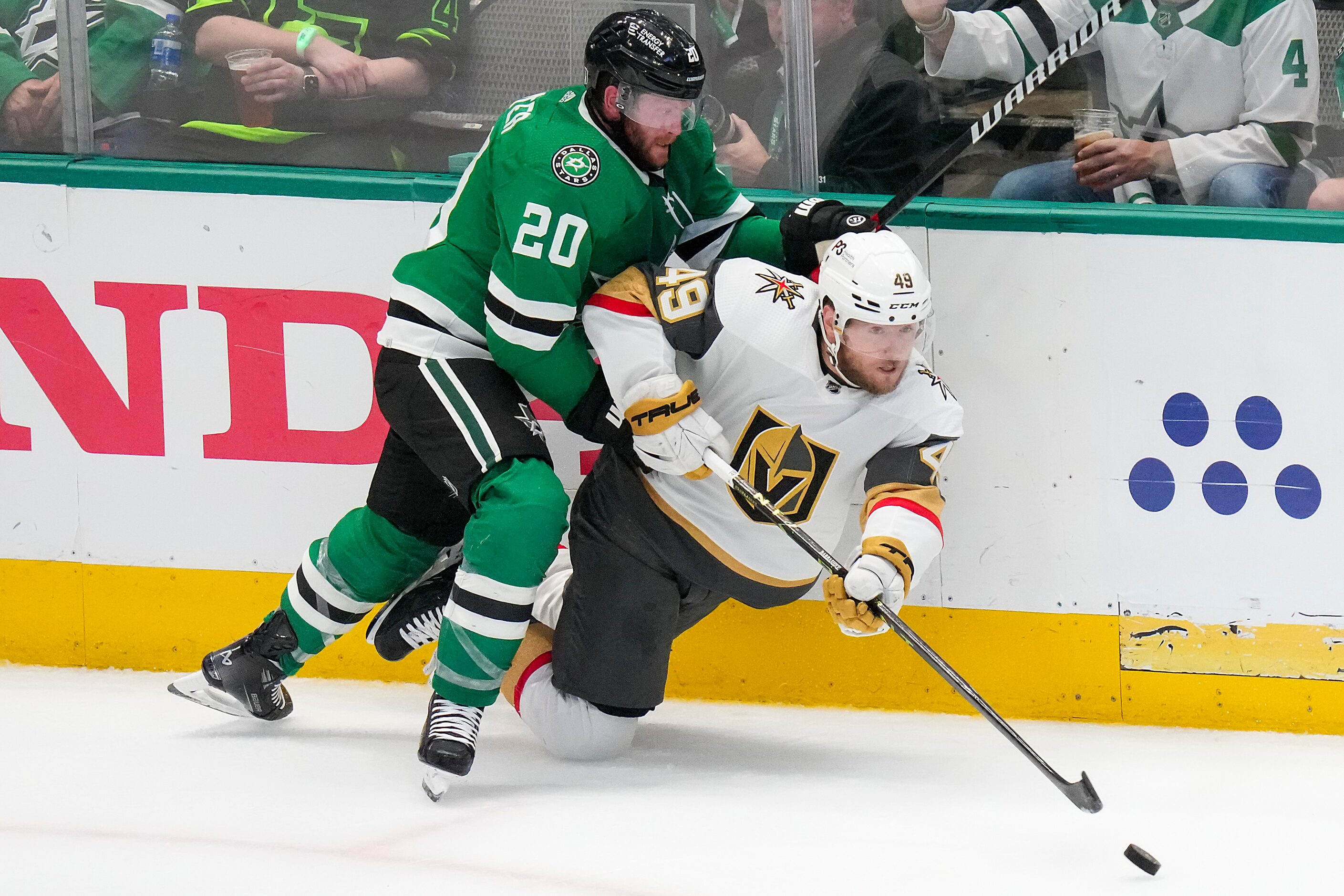 Vegas Golden Knights center Ivan Barbashev (49) clears the puck along the boards as he is...