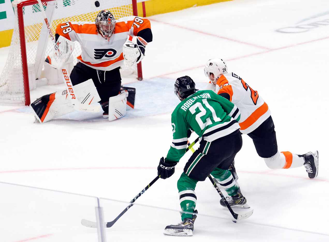 Dallas Stars left wing Jason Robertson (21) shoots a and scores against Philadelphia Flyers...