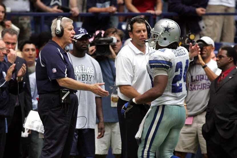 Dallas coach Bill Parcells (left) shakes the hand of RB Marion Barber (24 - right), as...