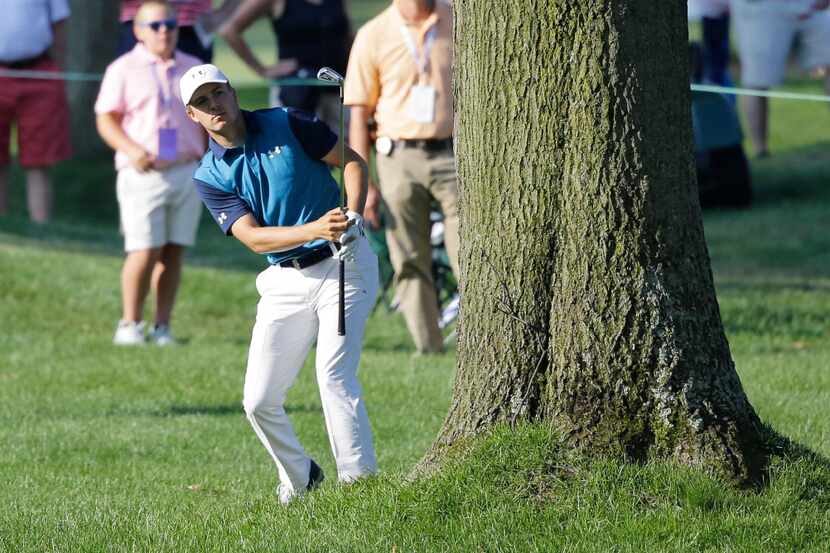 Jordan Spieth hits to the 13th green during the first round of the Bridgestone Invitational...
