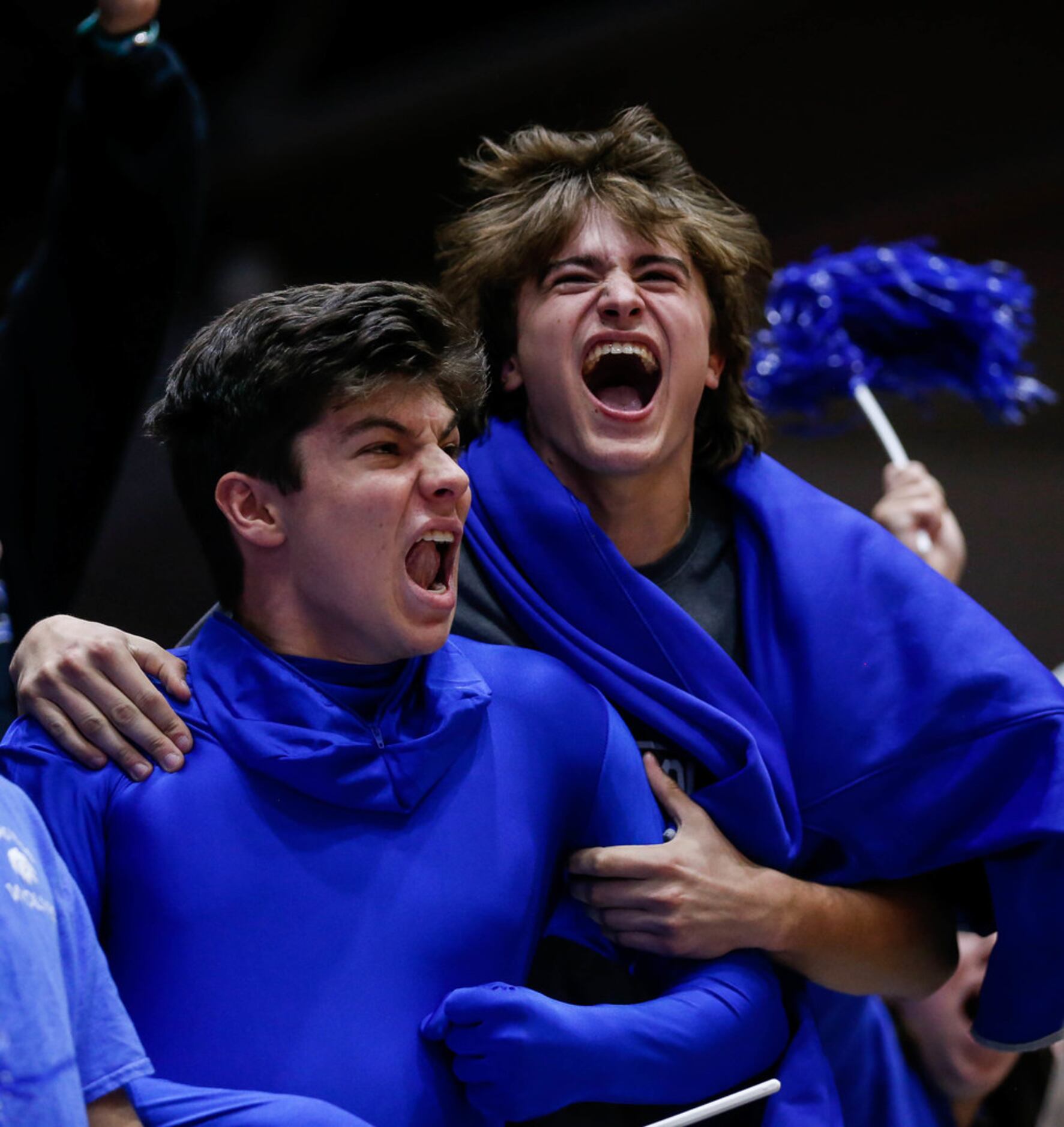 The Plano West Wolves student section celebrates after winning the fifth and final set...