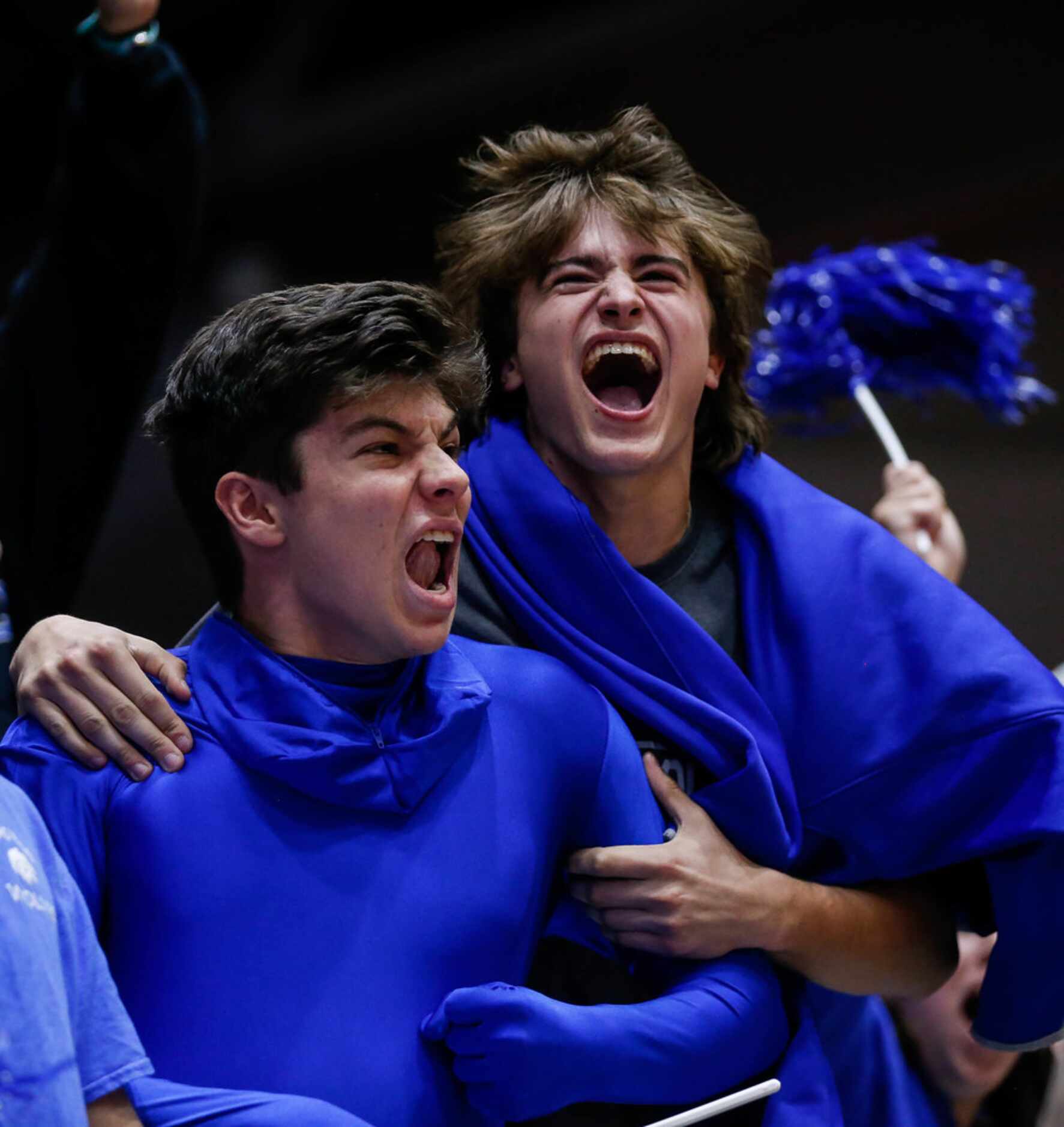 The Plano West Wolves student section celebrates after winning the fifth and final set...