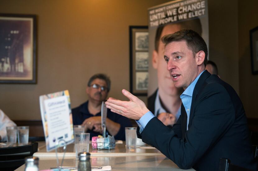 Jason Kander, an Army veteran, speaks during an event with military veterans in St. Louis on...