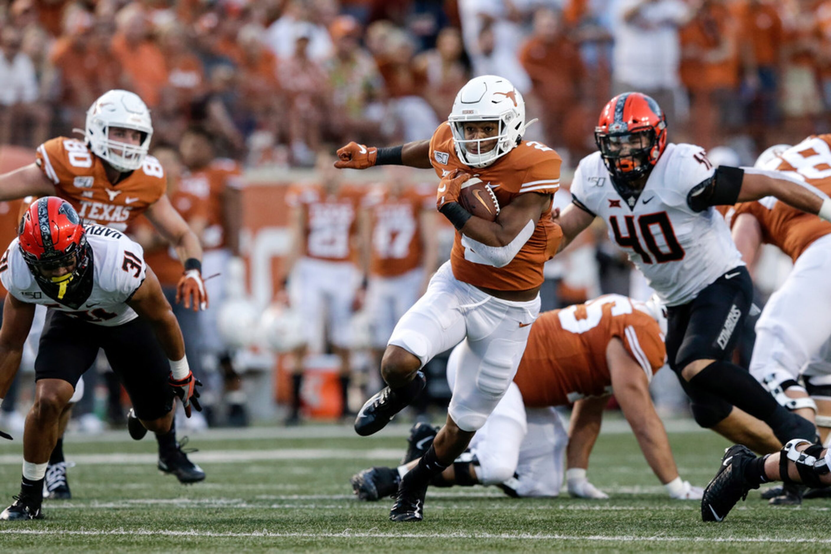 AUSTIN, TX - SEPTEMBER 21:  Roschon Johnson #2 of the Texas Longhorns runs the ball in the...