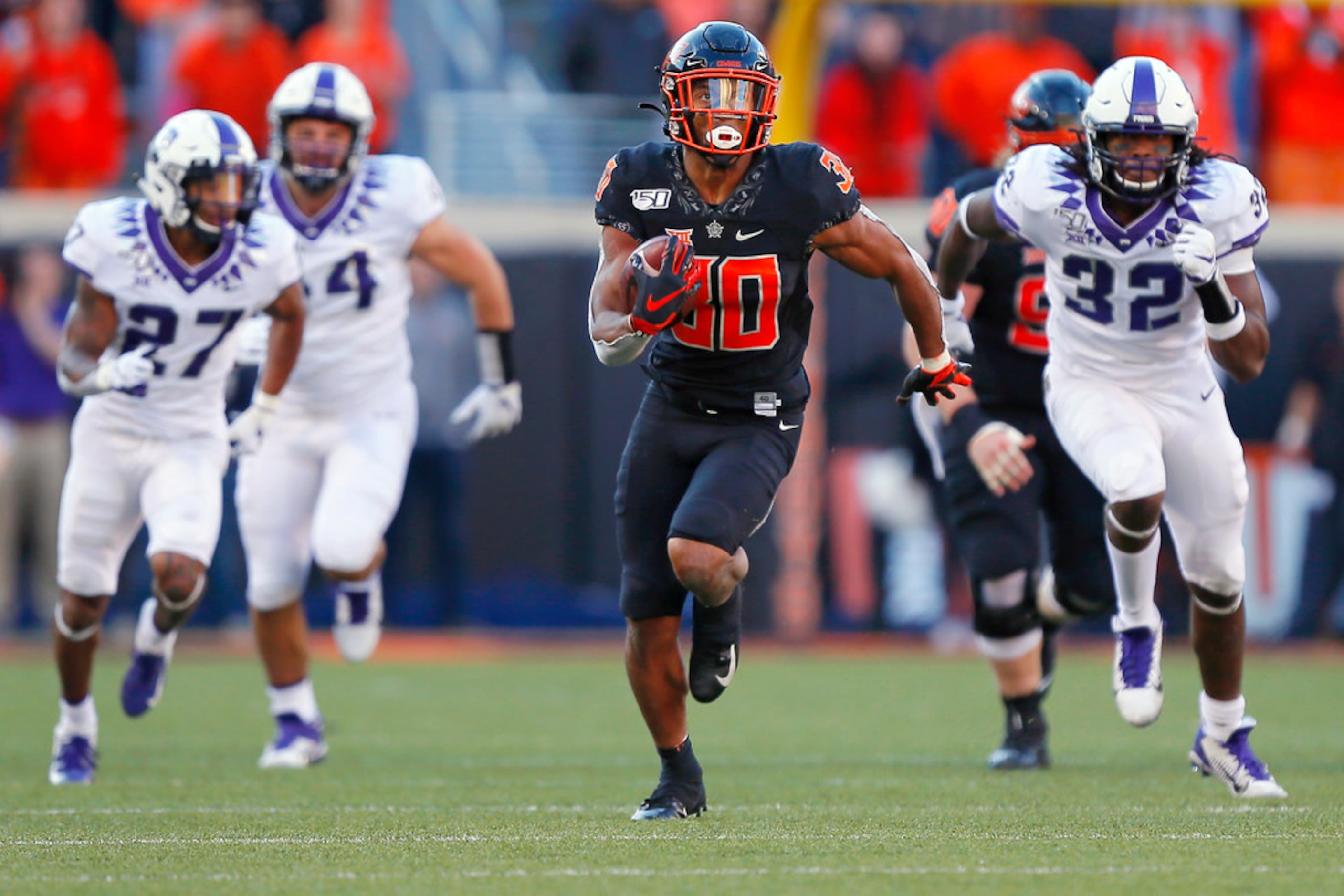 Barry Sanders Oklahoma State Cowboys Unsigned Running vs. Oklahoma Sooners  Photograph