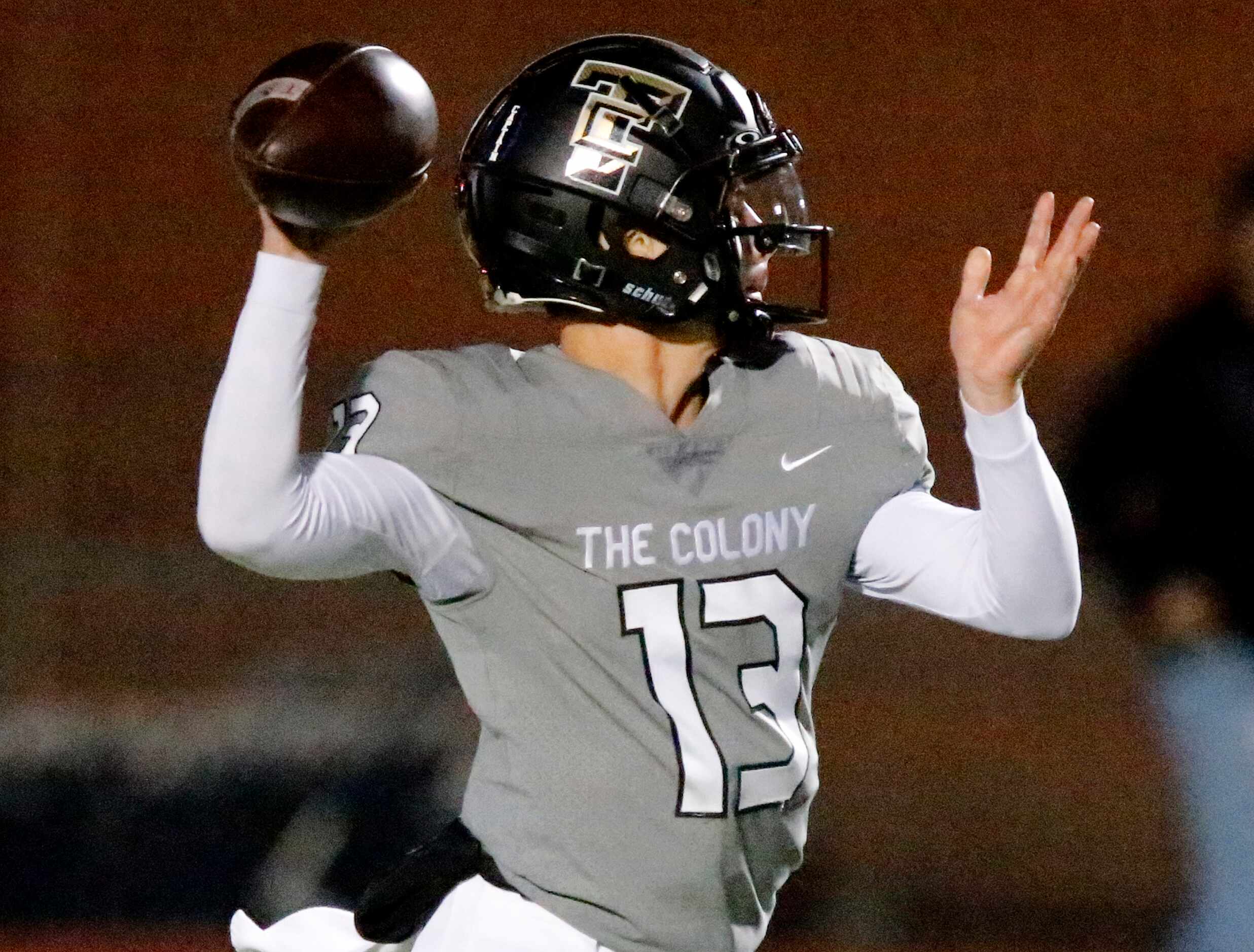 The Colony High School quarterback Dylan Corbin (13) throws a pass during the first half as...