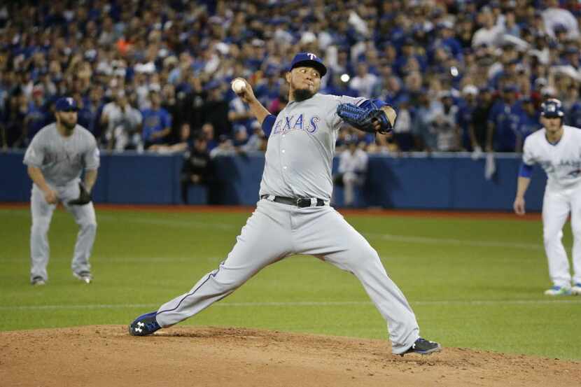 Texas Rangers starting pitcher Yovani Gallardo (49) throws a fourth-inning pitch during...