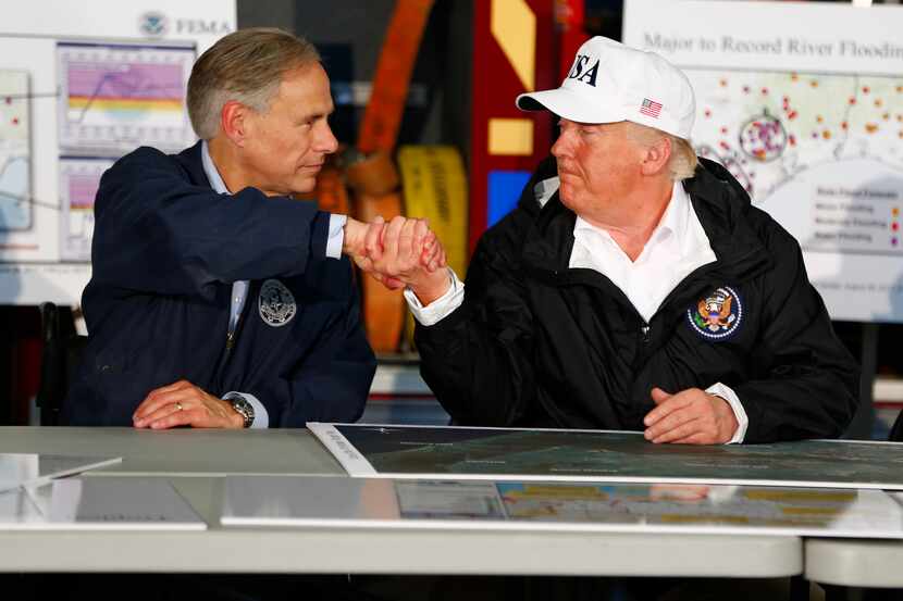 Gov. Greg Abbott greeted President Donald Trump on Tuesday at a briefing on the storm at a...