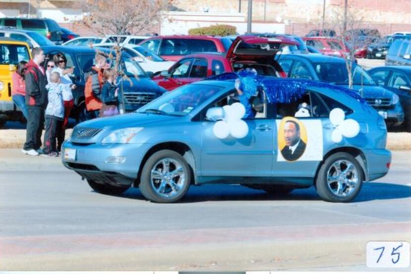 Participants wave from a car during last year’s Martin Luther King Jr. Day parade in...
