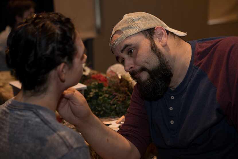 Dallas theater teacher Mark C. Guerra works with a performer before a production. Guerra...