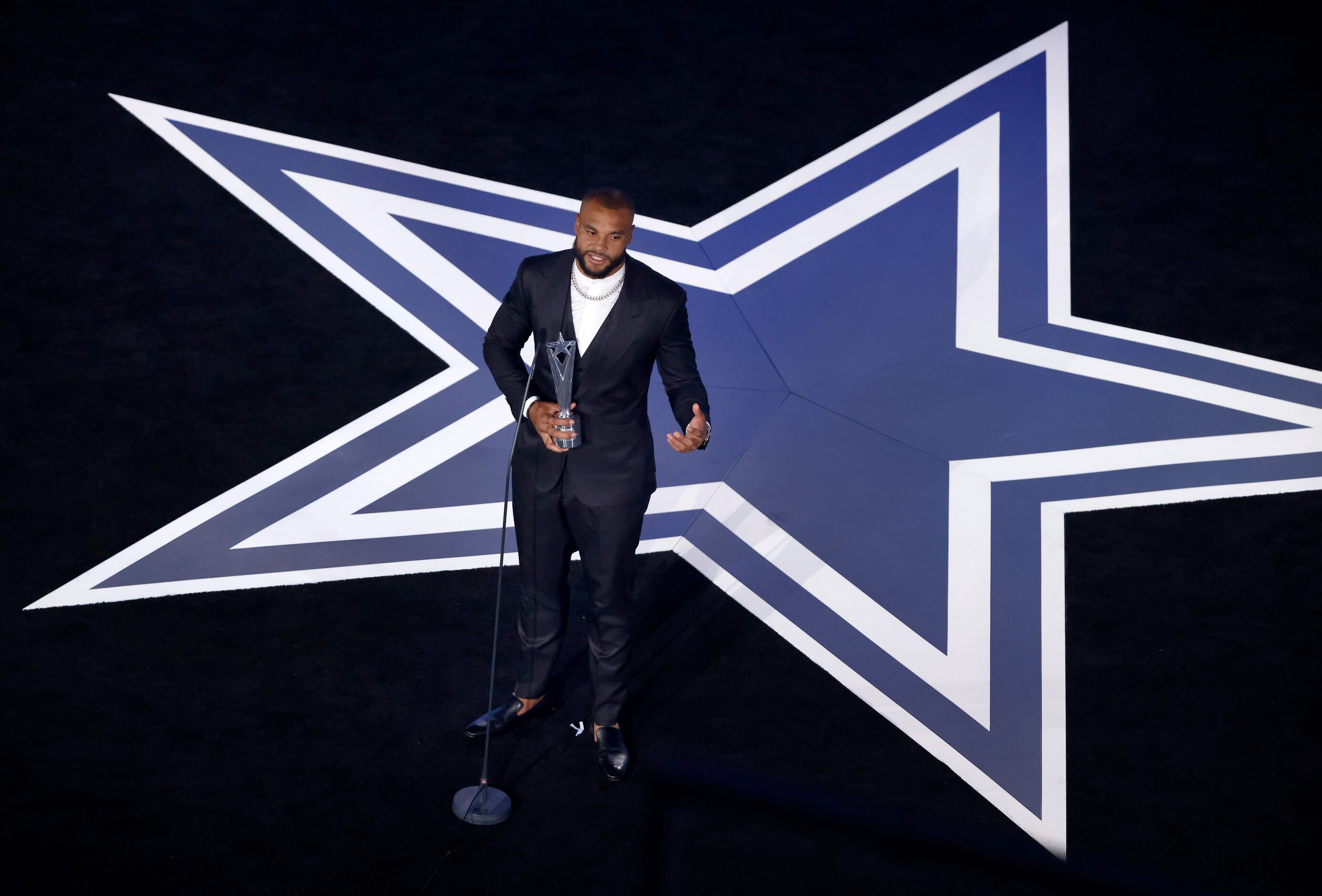 Dallas Cowboys quarterback Dak Prescott speaks after receiving the Beyond the Gridiron Award...