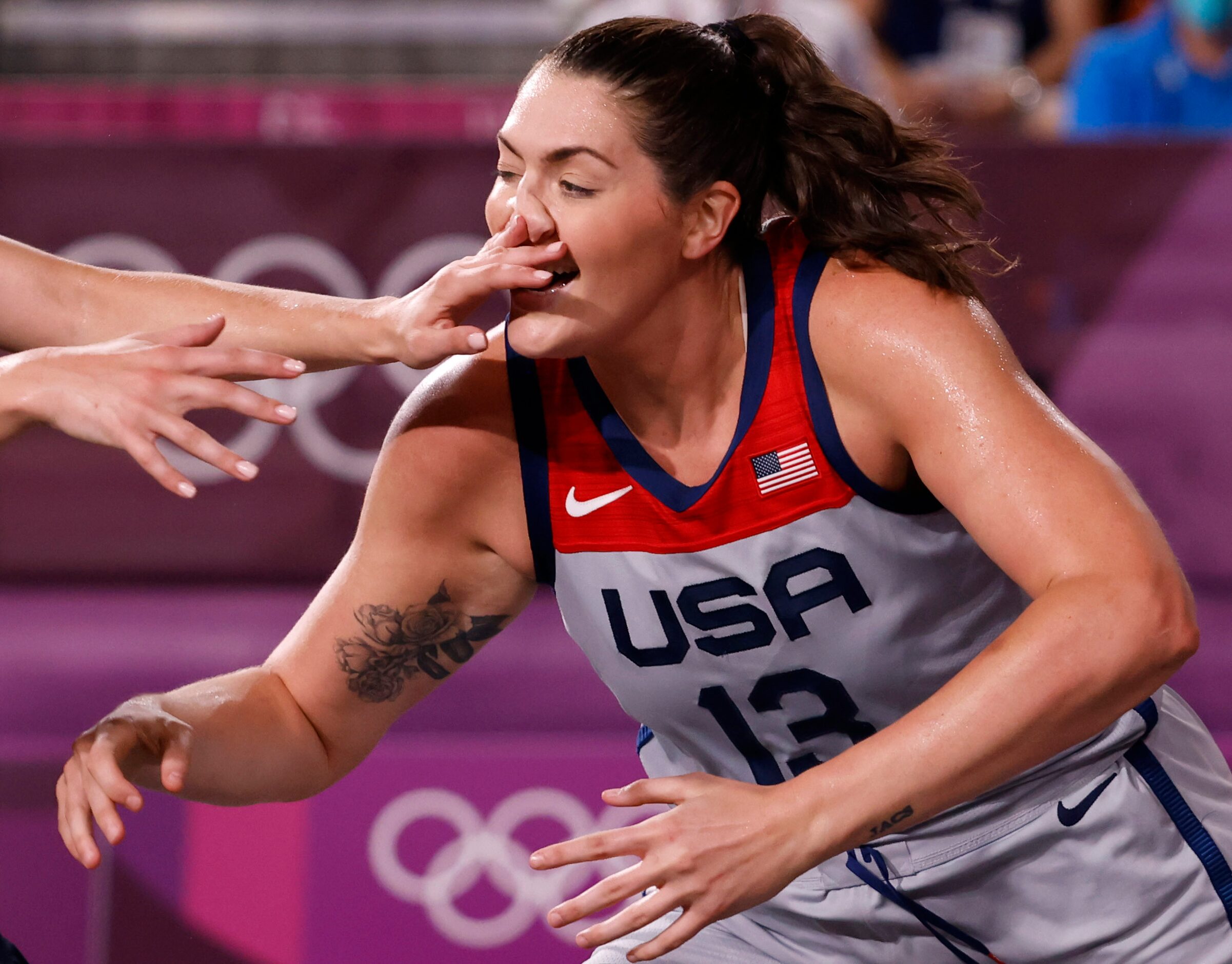 USA’s Stefanie Dolson (13) is hit in the face by ROC’s Olga Frolkina (15) on a play during...