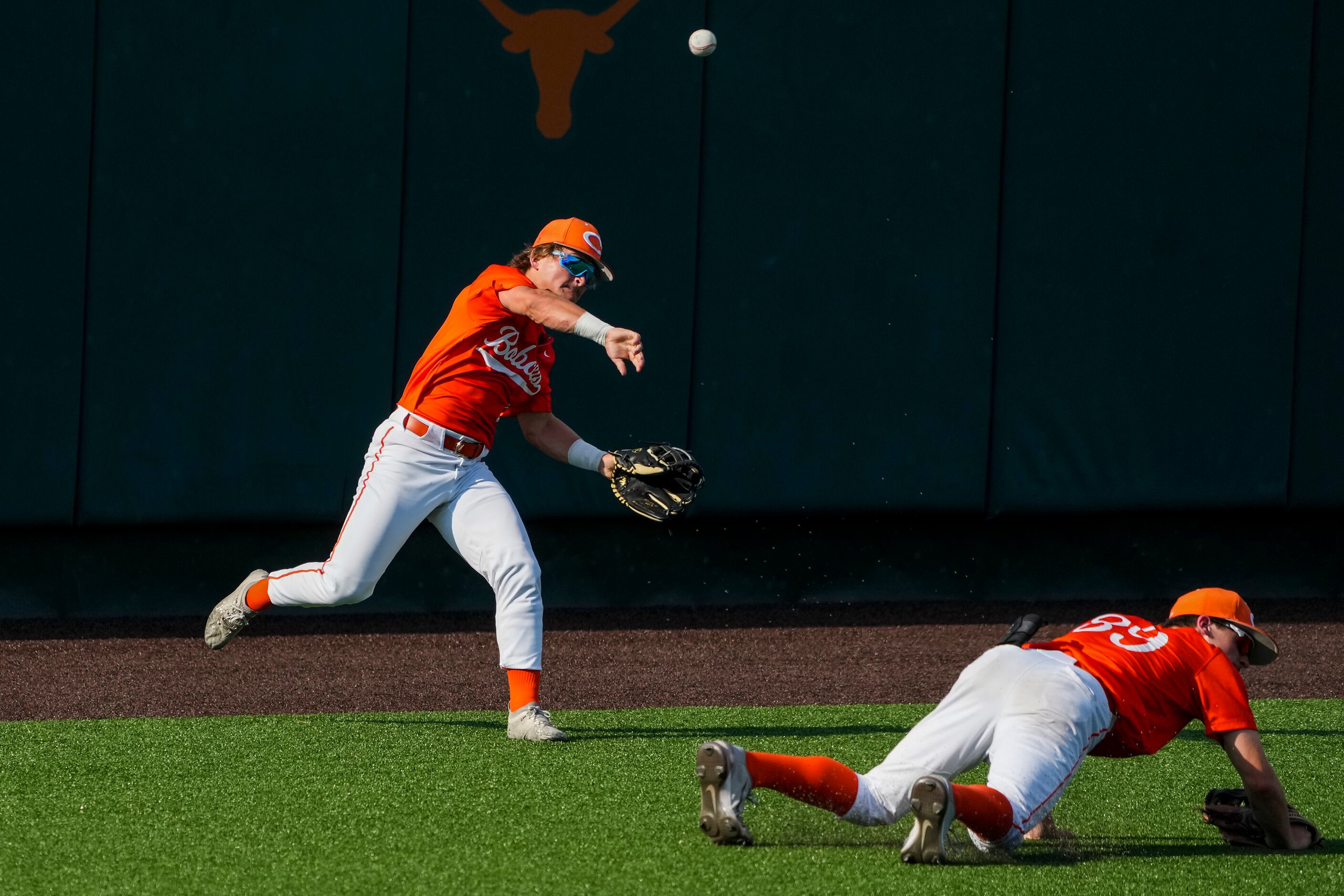 Celina outfielder Sean Rabe (1) makes a throw over RJ Ruais (89) during the fifth inning of...