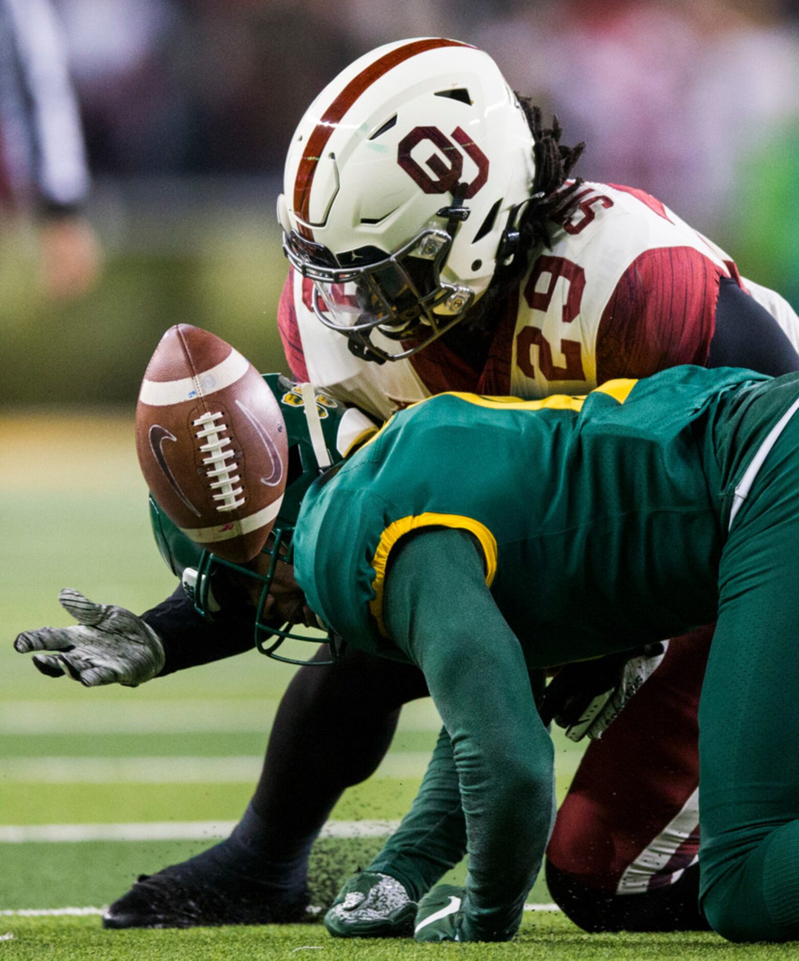 Oklahoma Sooners running back Rhamondre Stevenson (29) recovers his own fumble near Baylor...