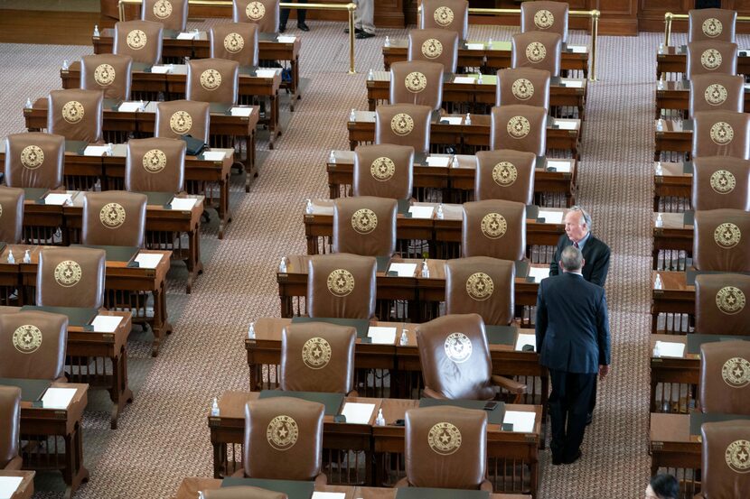 Rep. Todd Hunter, R-Corpus Christi, talked with a colleague as the House gathered late on...