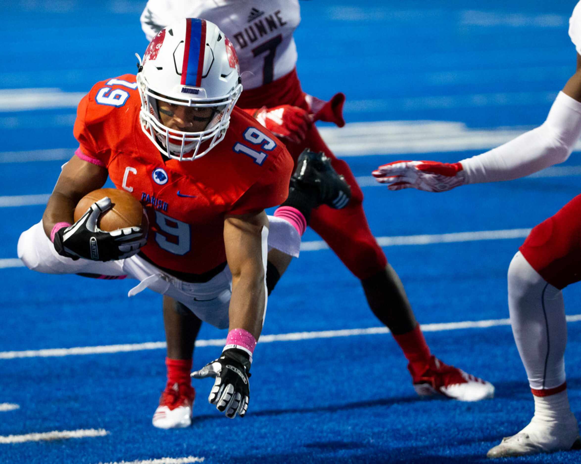 Parish Episcopal wide receiver Kaleb Culp (19) dives to earn yards during the football game...