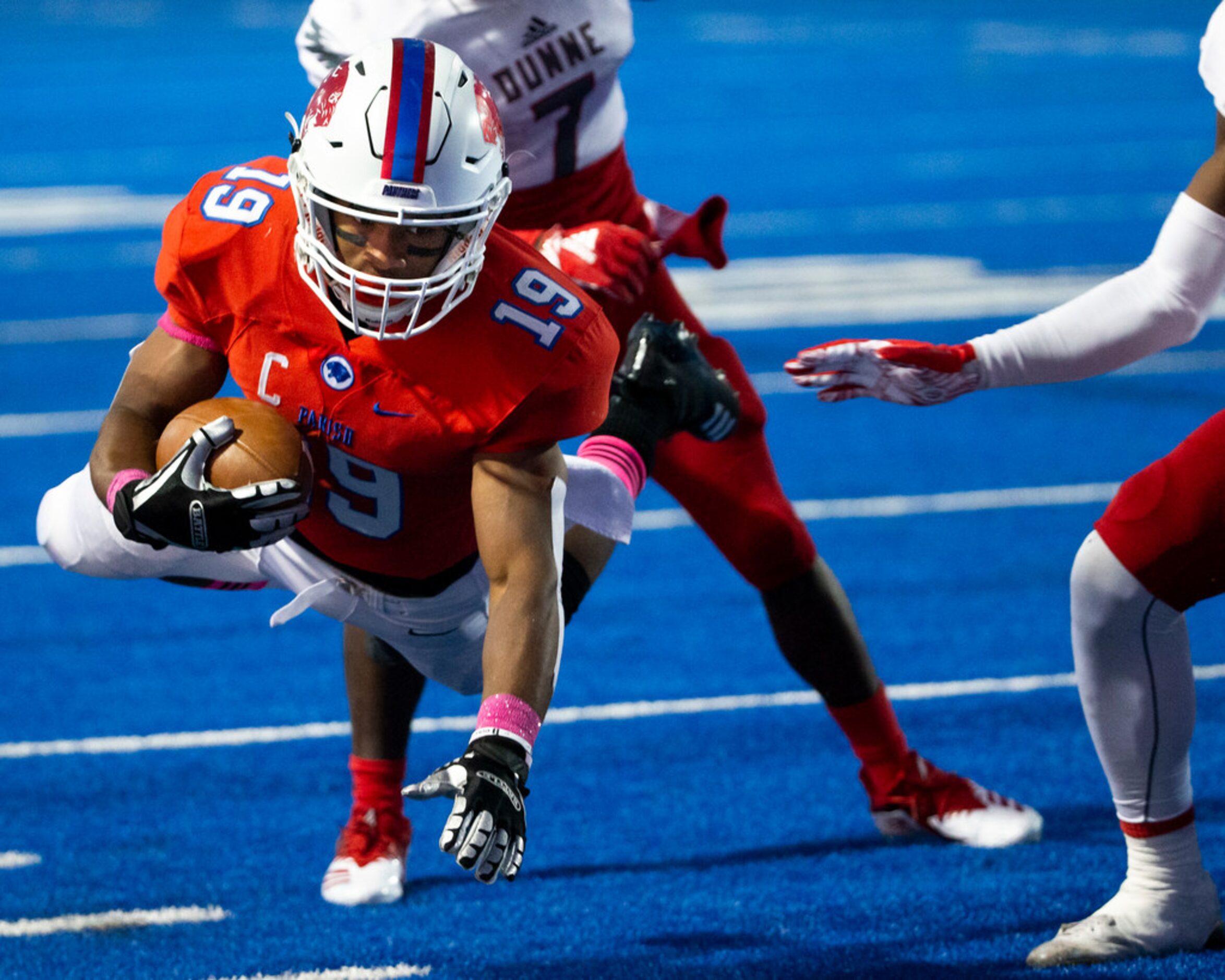 Parish Episcopal wide receiver Kaleb Culp (19) dives to earn yards during the football game...