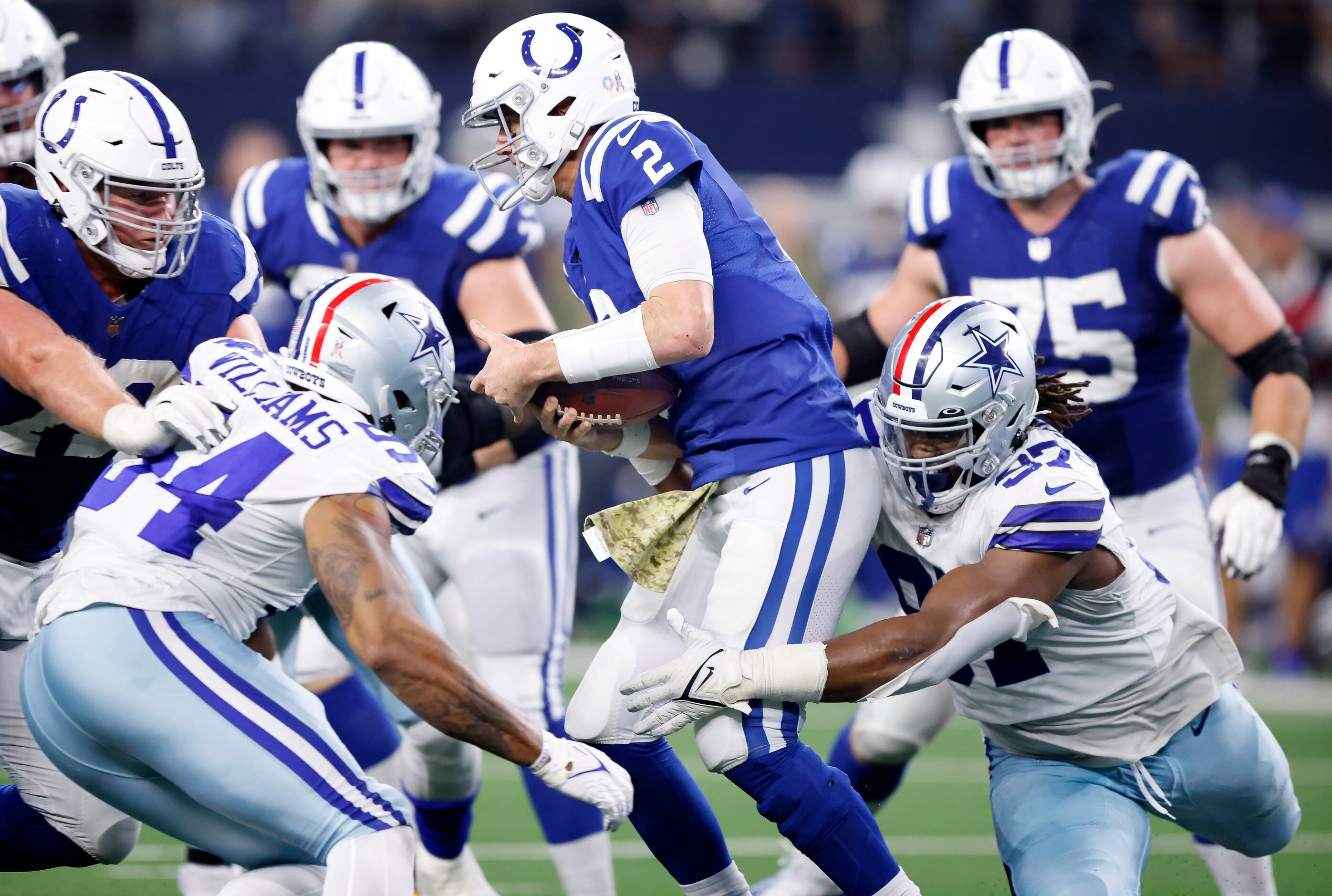 Dallas Cowboys defensive tackle Osa Odighizuwa (97) sacks Indianapolis Colts quarterback...