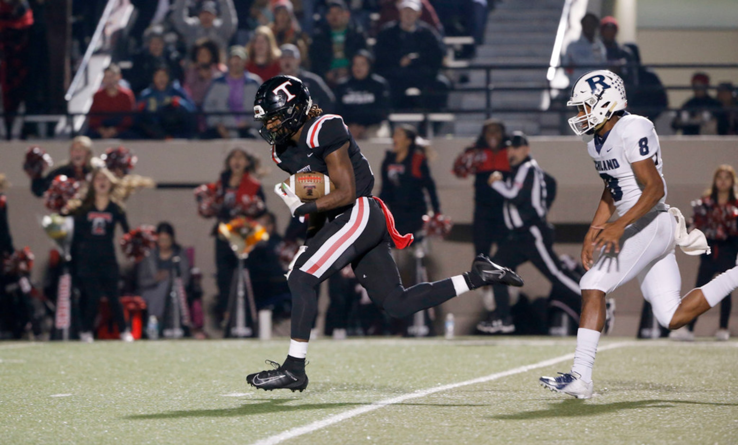 Euless Trinity receiver Jacob Schaeffer (13) catches a long pass as Richland's Da'lon Arthur...