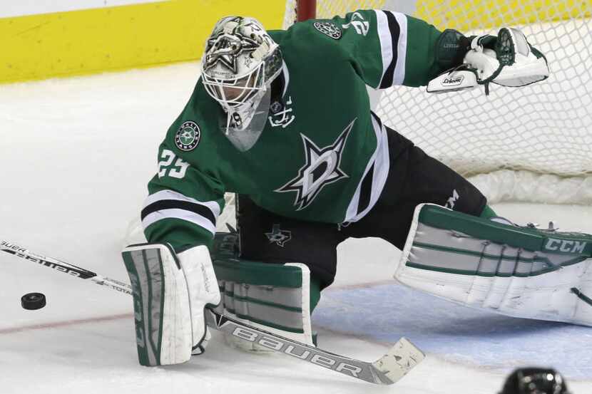 Dallas Stars goalie Anders Lindback (29) blocks a shot during the second period of an NHL...