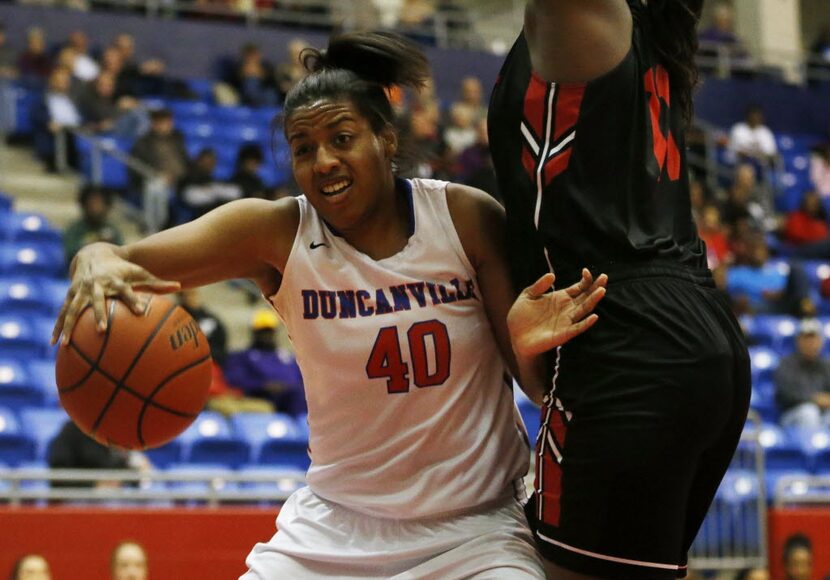 Duncanville Pantherettes post Ciera Johnson (40) tries to drive past South Grand Prairie...