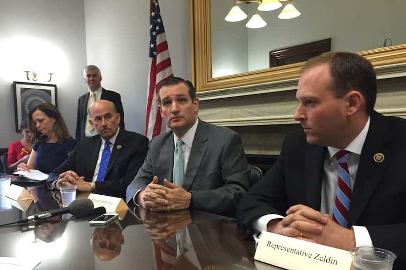  Sen. Ted Cruz (second from right), seen here on July 28, 2015 in his Capitol Hill office,...