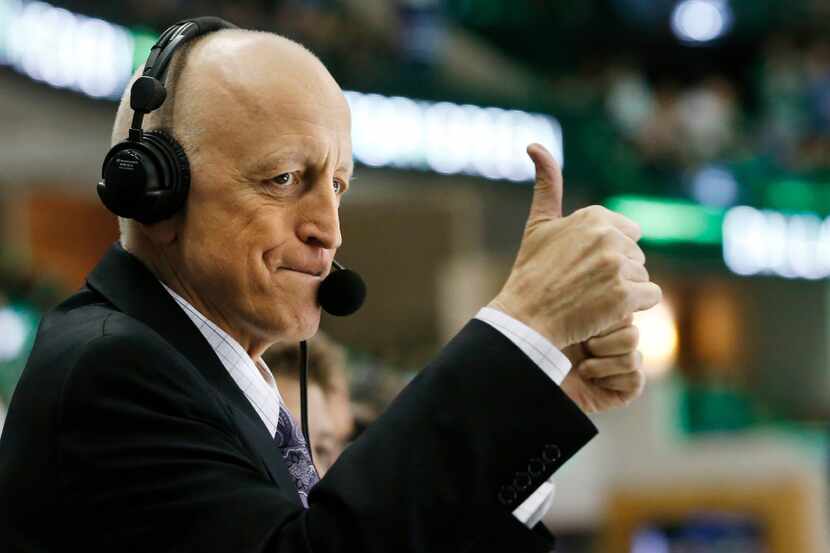 Dallas Stars play-by-play caller, Dave Strader acknowledges the crowd as he is introduced to...